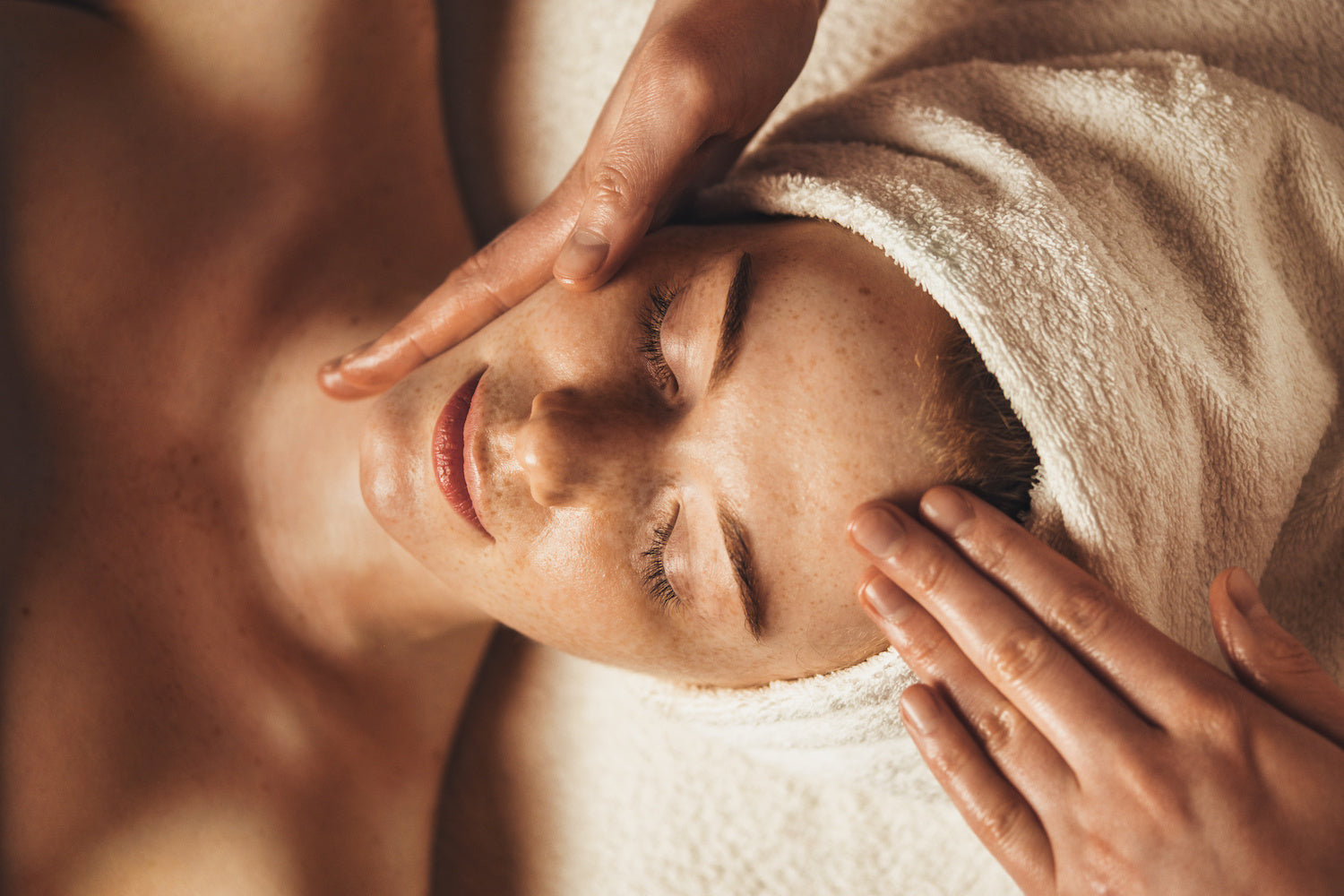 woman receiving a skin care facial massage